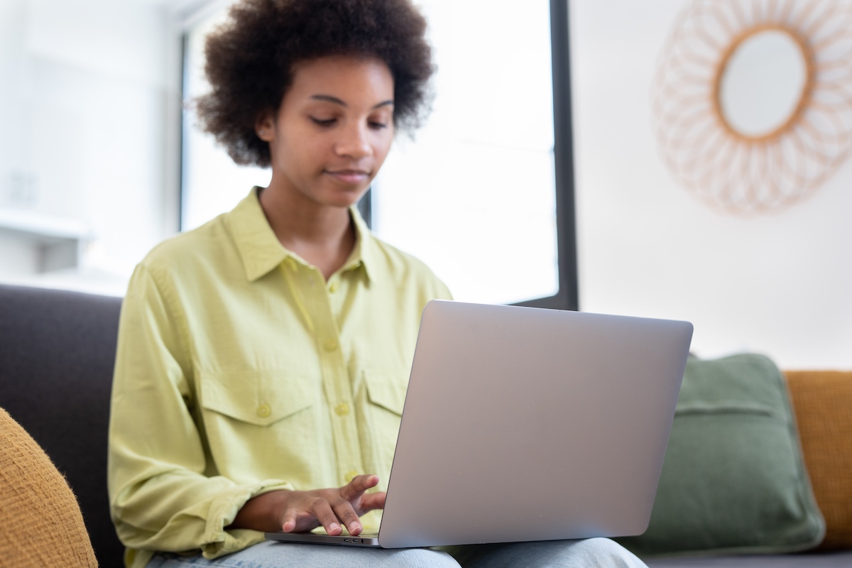 Young woman looking at laptop